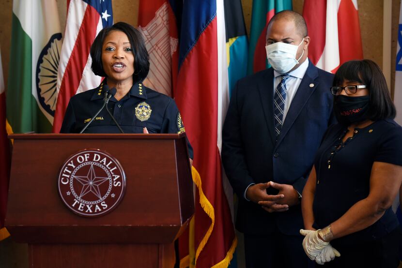 Dallas Chief of Police Renee Hall, left, and Dallas Mayor Eric Johnson, right, conduct a...