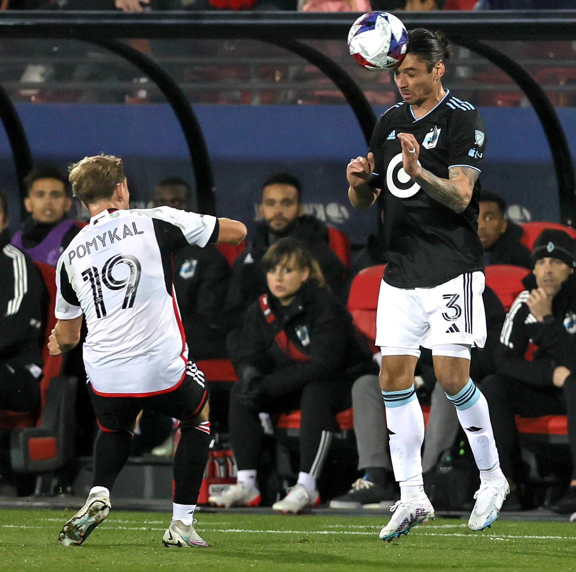 Minnesota United defender Zarek Valentin (3) tries to head the ball away from FC Dallas...