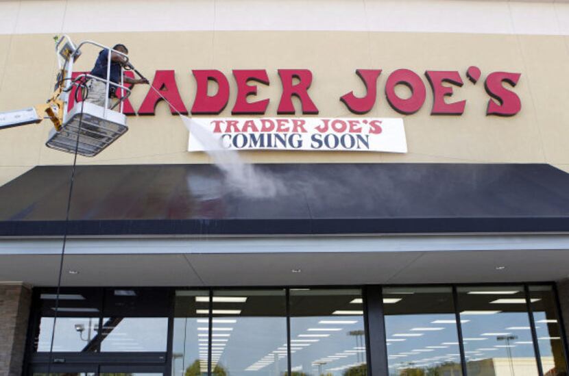 Cathy Ramos power washes the awning at Trader Joe's in Plano on September 6, 2012. The Plano...