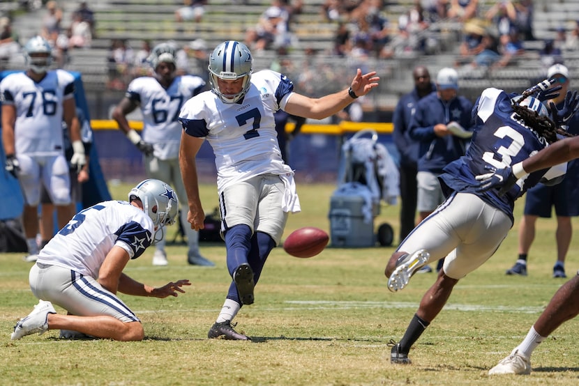 Dallas Cowboys punter Hunter Niswander (7) kicks a field goal from the hold of punter Bryan...