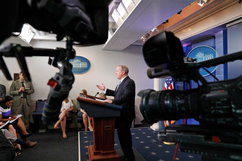 White House press secretary Sean Spicer speaks as cameras are pointed away during an...