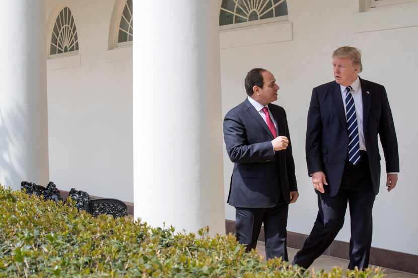 President Donald Trump walks with Egyptian President Abdel-Fattah el-Sissi to the State...