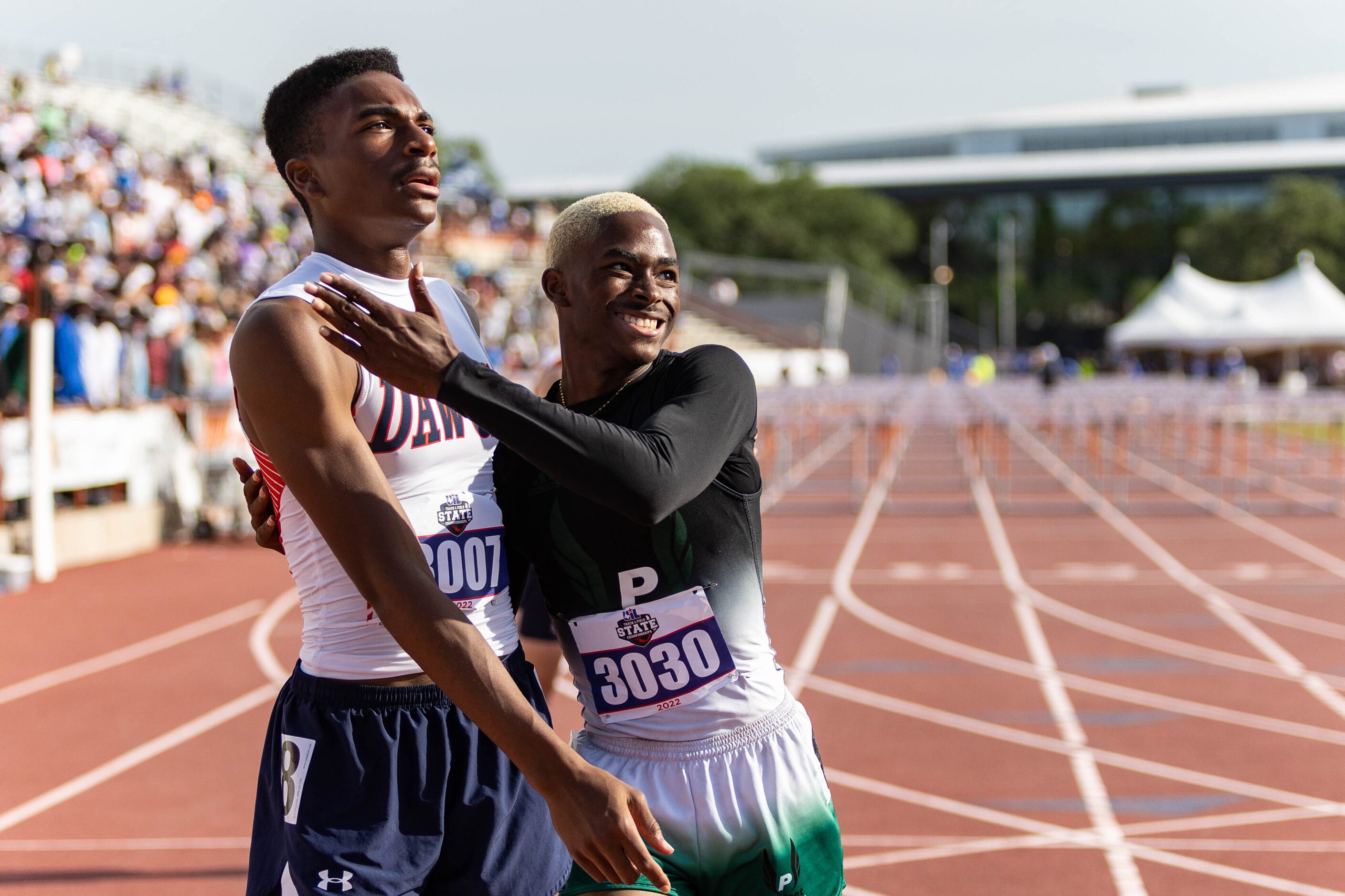 Kody Blackwood of McKinney North and Kendrick Smallwood of Mesquite Poteet embrace after the...