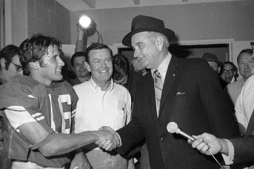 FILE - This Jan. 1, 1970 Former President Lyndon B. Johnson congratulates Texas quarterback...