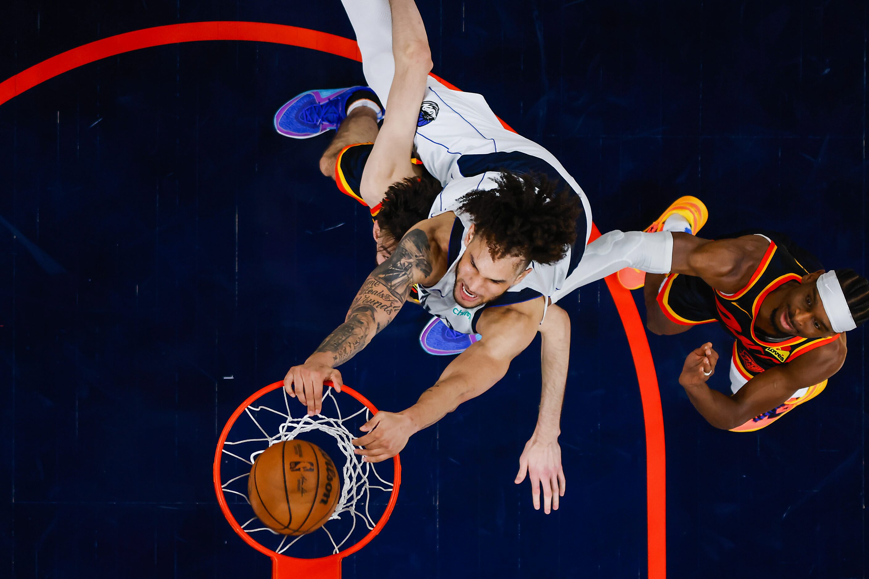 Dallas Mavericks center Dereck Lively II (2) dunks the ball past Oklahoma City Thunder guard...