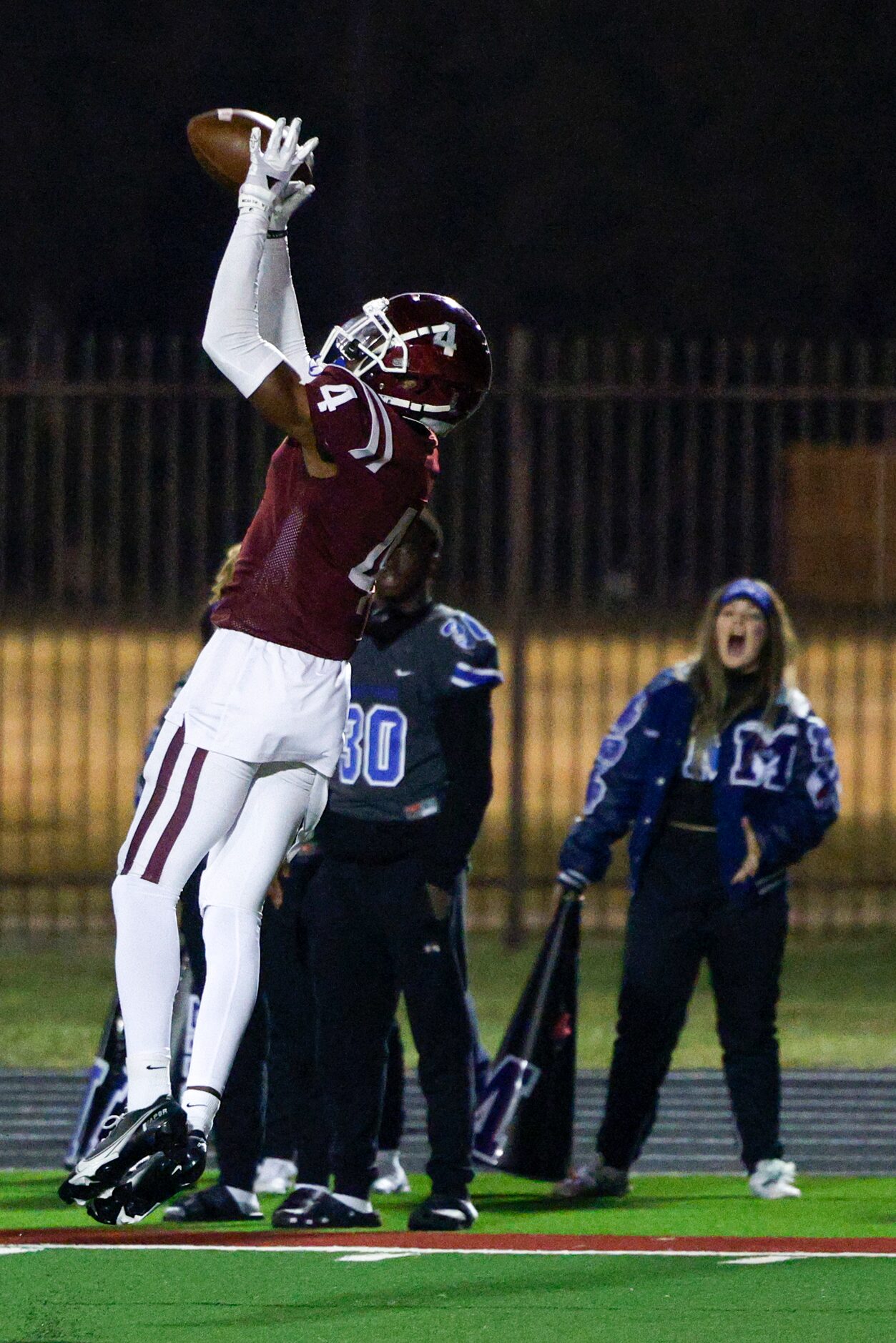 Red Oak defensive back Maurice Wells (4) intercepts a pass near the goal line during the...