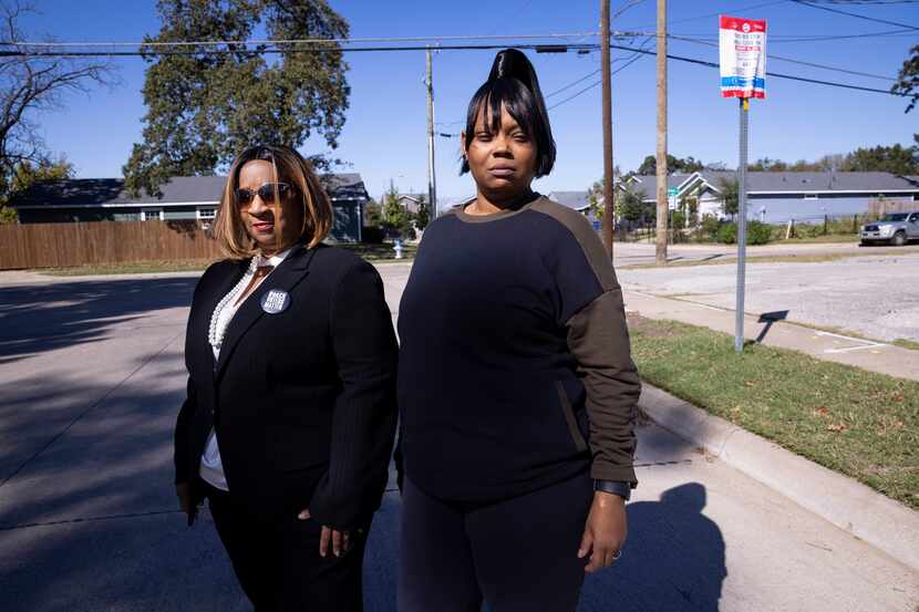 Claudia Fowler (left) and Temeckia Derrough pose for a photo in front of a bus stop on...