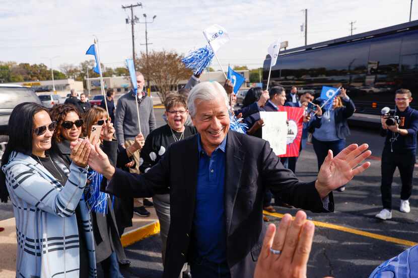 JPMorgan Chase staff welcome CEO Jamie Dimon (center) to a branch in the Oak Cliff area of...