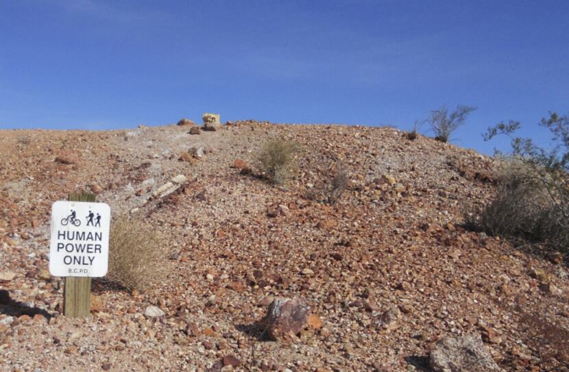 Mountain bikers can access dirt trails of Bootleg Canyon off the southern segment of fully...