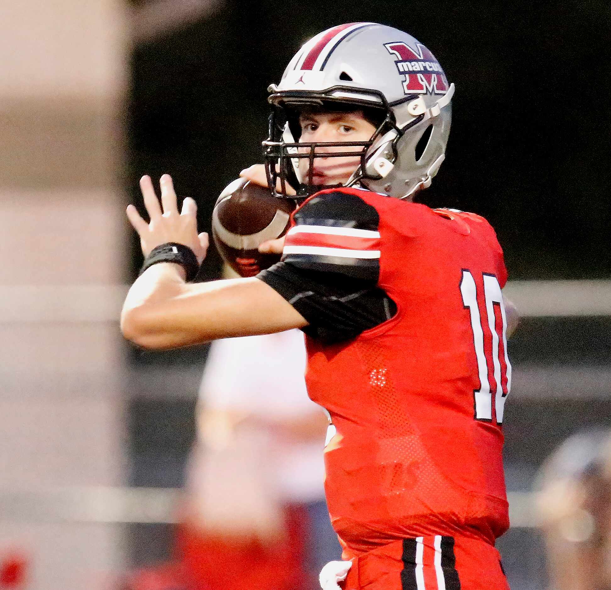 Flower Mound Marcus High School quarterback Cole Weliver (10) during the first half as...