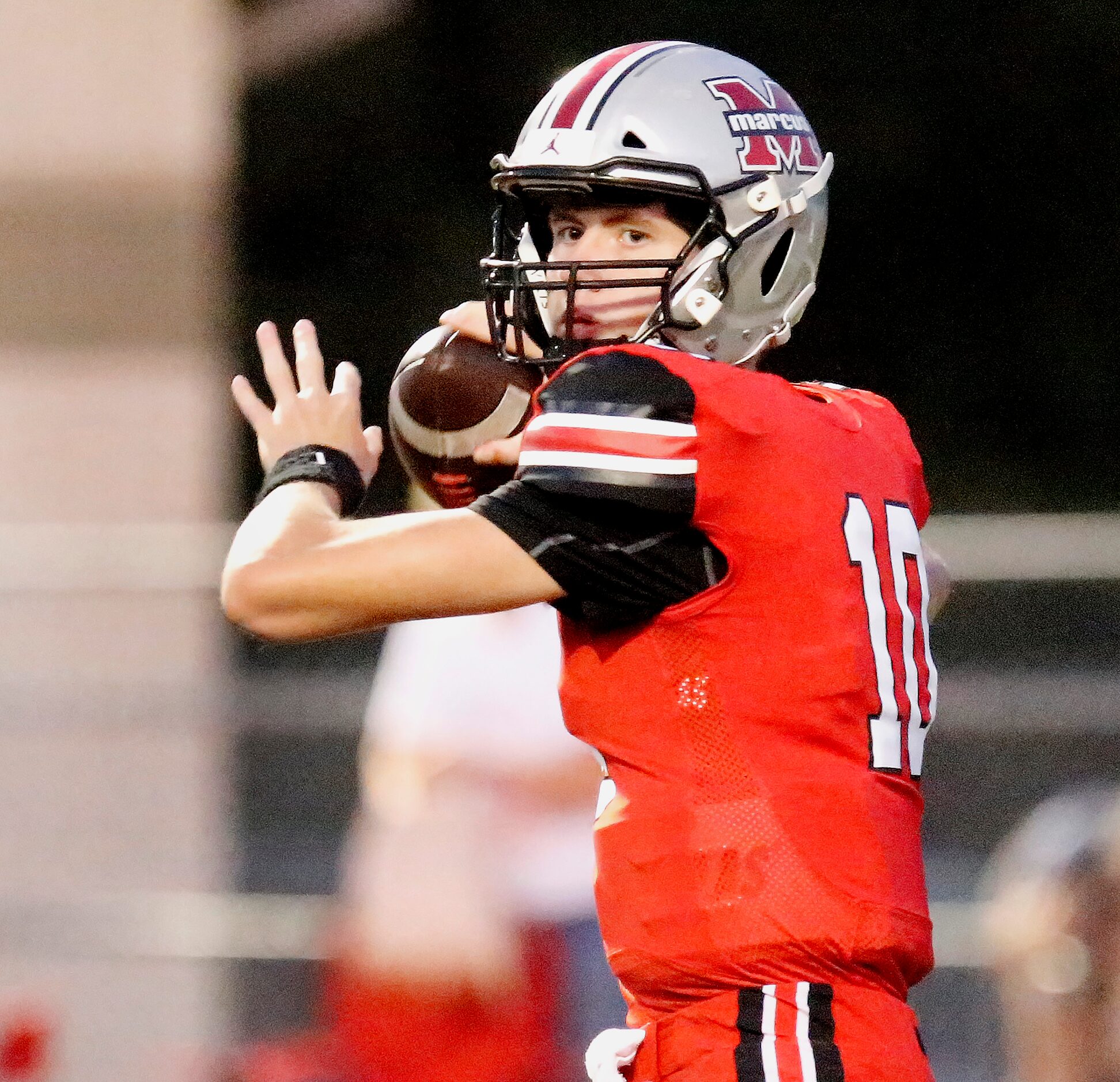 Flower Mound Marcus High School quarterback Cole Weliver (10) during the first half as...