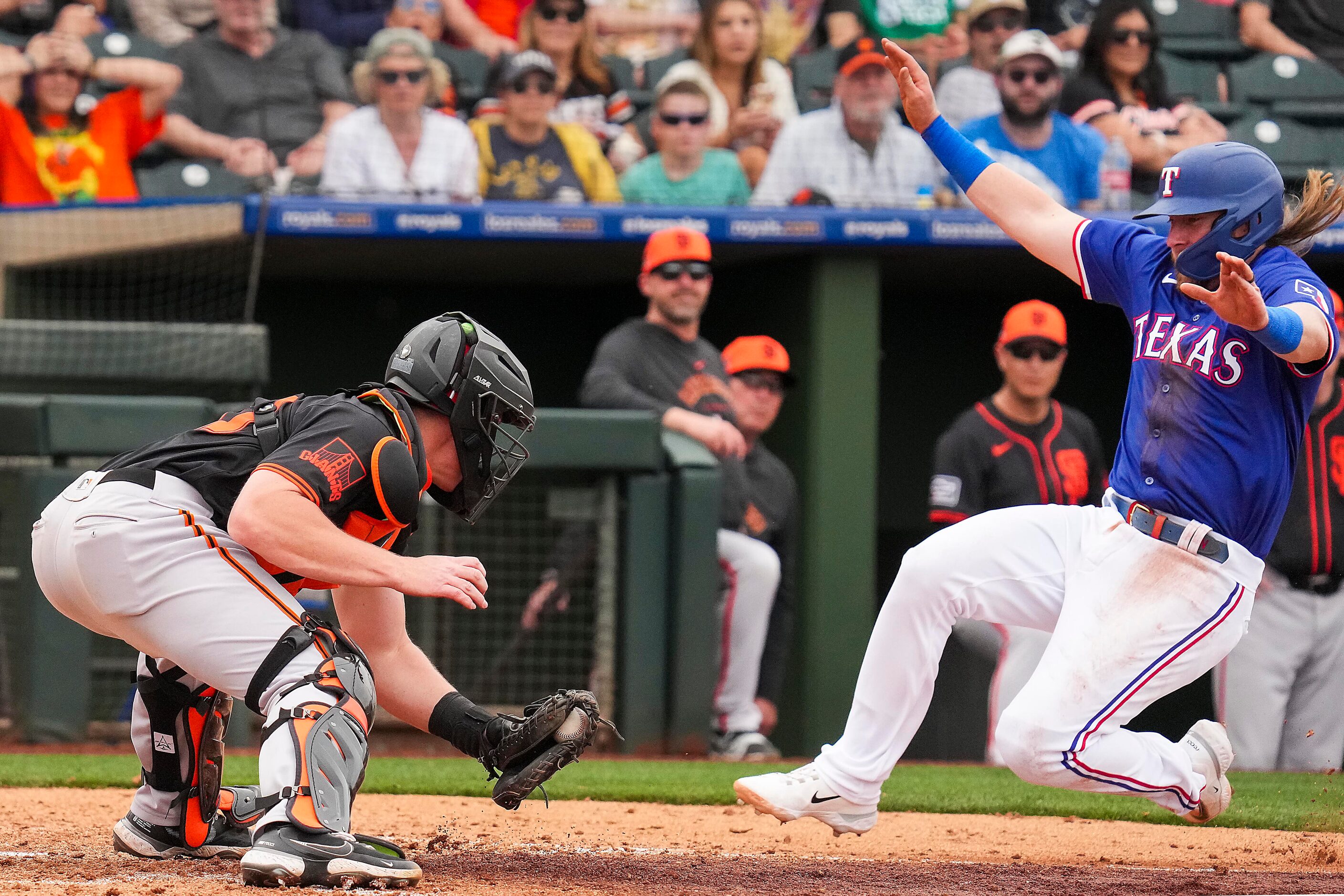 San Francisco Giants catcher Jakson Reetz prepares the tag as Texas Rangers infielder Davis...