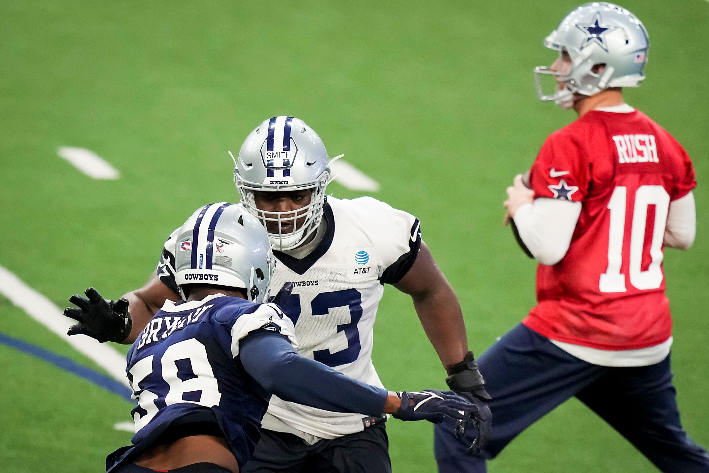 Dallas Cowboys offensive lineman Tyler Smith (73) works against defensive tackle Markaviest...