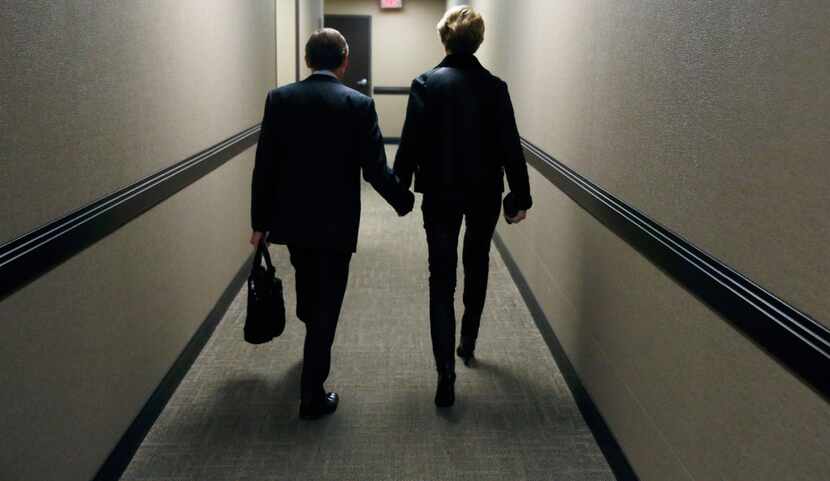 Laura Miller and her husband, Steven D. Wolens, leave her doctor's office. (David Woo/The...