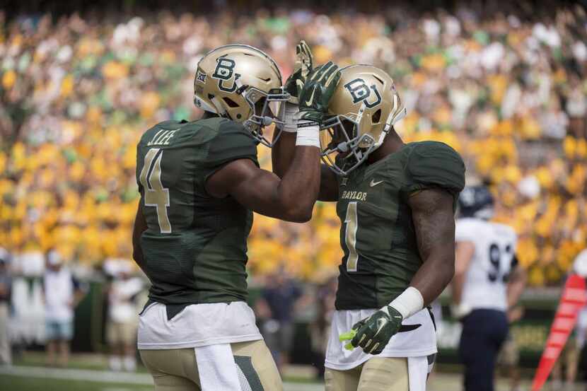 Sep 26, 2015; Waco, TX, USA; Baylor Bears wide receiver Jay Lee (4) and wide receiver Corey...