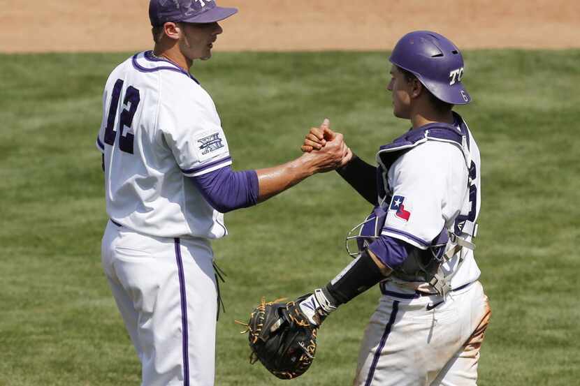 TCU's Riley Ferrell (12) celebrates with catcher Kyle Bacak (6) at the end of a first-round...