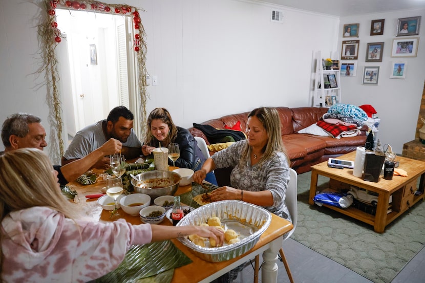 Kristiel Ferguson, front right, her older sister Alejandra Chacin, back right, her brother...