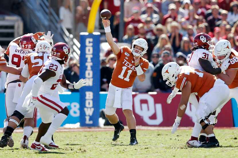 Texas Longhorns quarterback Sam Ehlinger (11) attempts a pass in a game against Oklahoma...