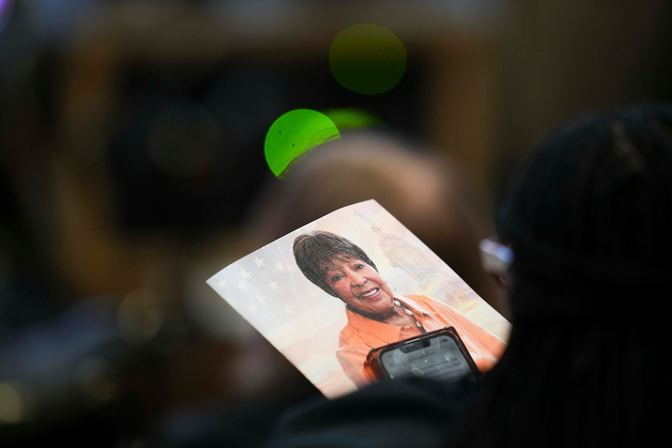 A mourner holds a program during funeral services for former U.S. Rep. Eddie Bernice Johnson...