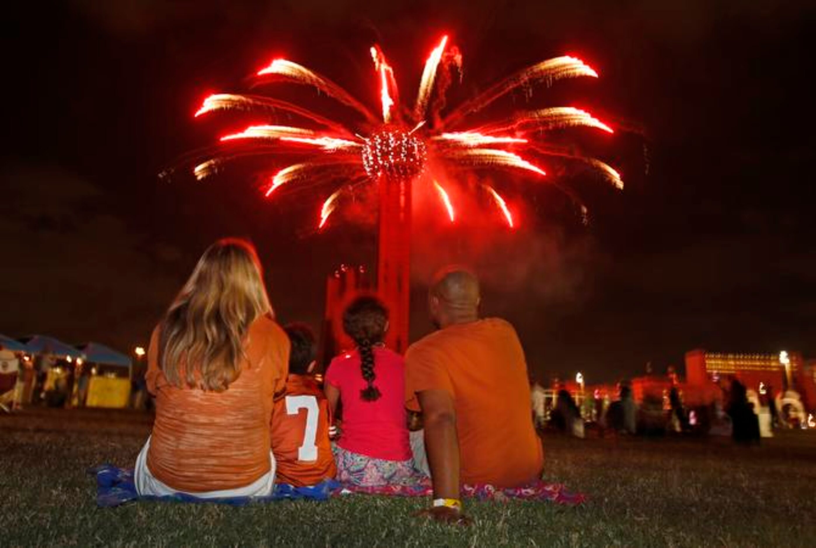 
Amanda, Brodie, Caitlyn and Eric Clemons of Austin sit mesmerized as Reunion Tower puts on...