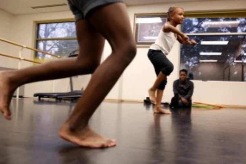  Children dance during an after-school program at St. Philip's School and Community Center....