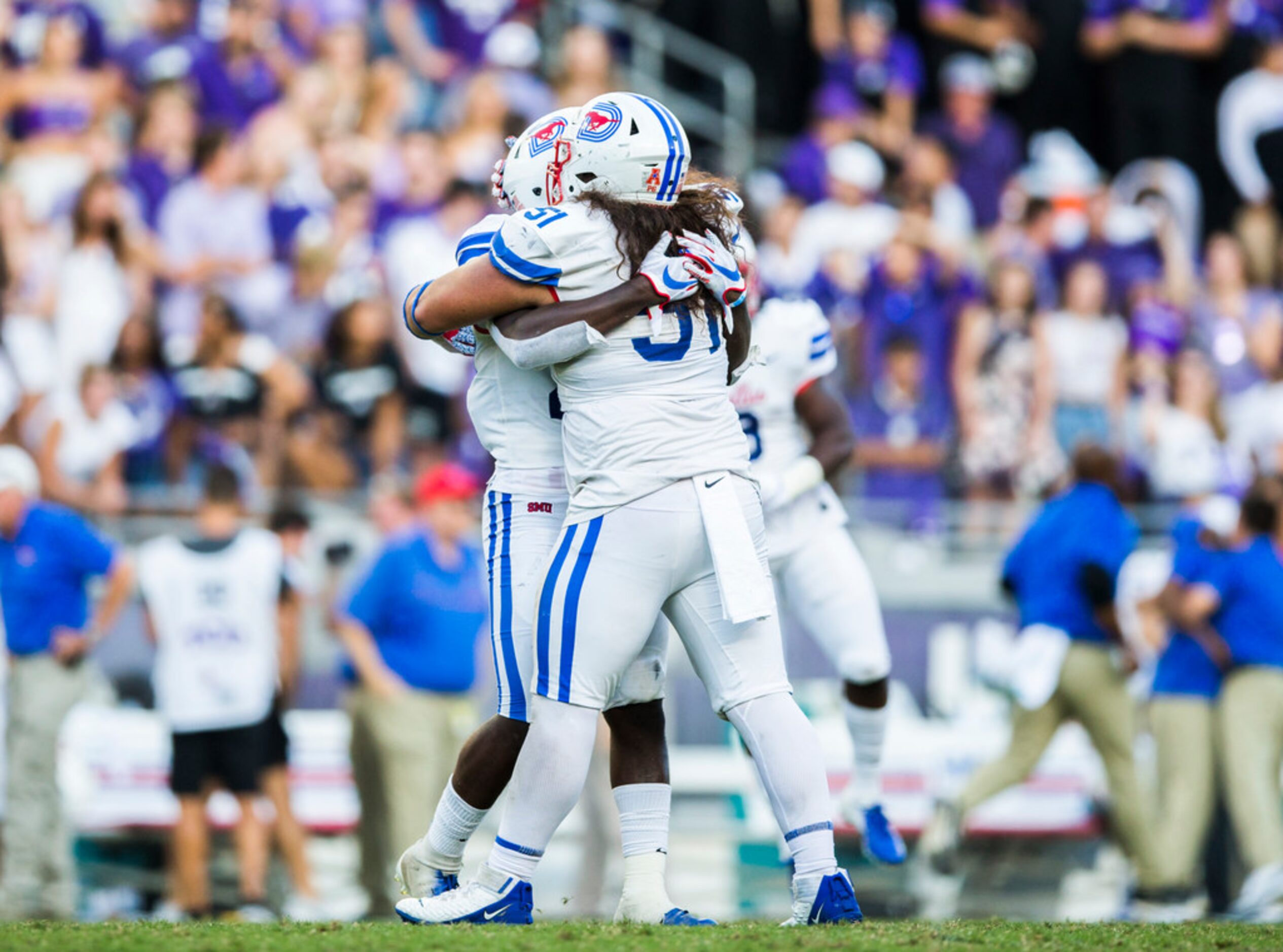 Southern Methodist Mustangs defensive back Brandon Stephens (26) and defensive tackle Pono...