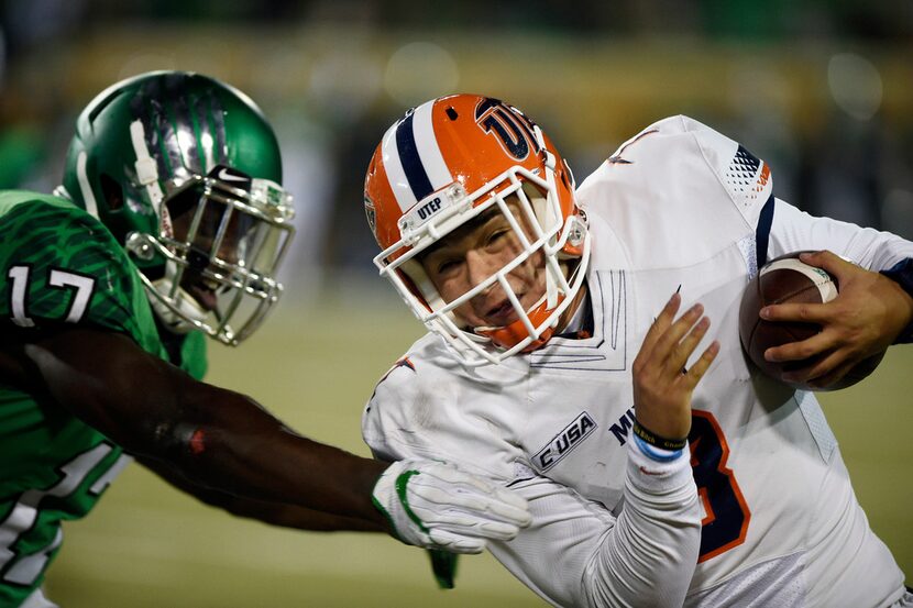 North Texas linebacker Joe Ozougwu (17) tackles UTEP quarterback Mark Torrez (3) in an NCAA...