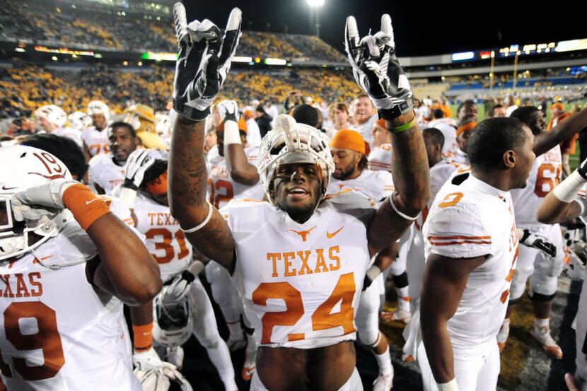 Texas running back Joe Bergeron (24) celebrates after beating the West Virginia 47-40 in...