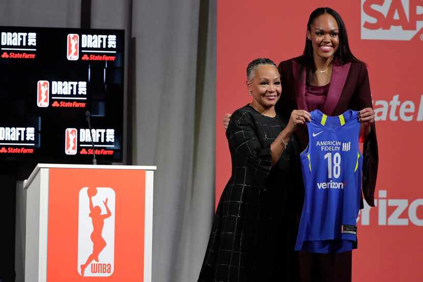 Connecticut's Azura Stevens, right, poses for a photo with WNBA President Lisa Borders after...