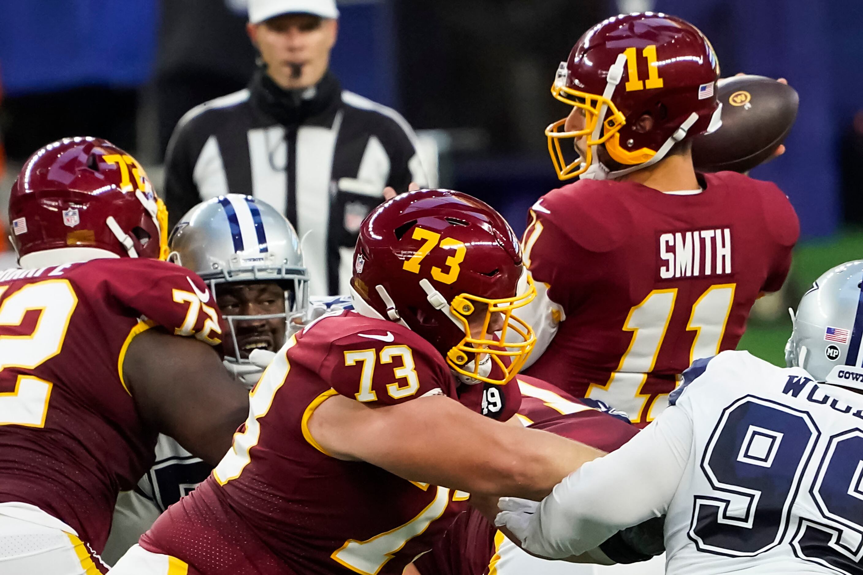 Washington Football Team quarterback Alex Smith (11) is sacked by Dallas Cowboys defensive...