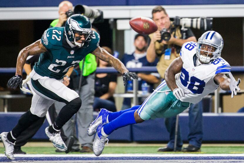 Dallas Cowboys wide receiver Dez Bryant (88) reaches for a pass in the end zone ahead of...