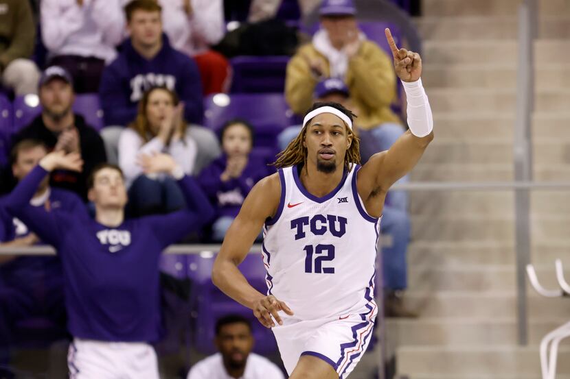 TCU forward Xavier Cork celebrates after sinking a basket in the second half of an NCAA...