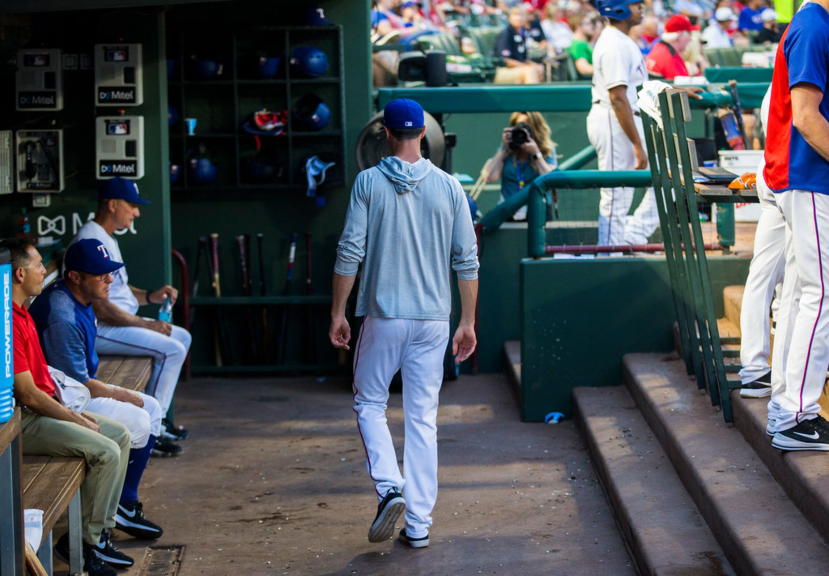 Texas Rangers starting pitcher Cole Hamels (35) walks out of the Rangers dugout during the...