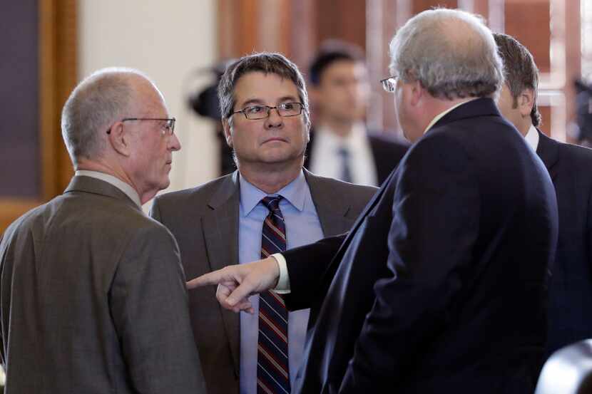 Sen. Charles Perry, R-Lubbock (center) filed Senate Bill 415 to ban what abortion opponents...