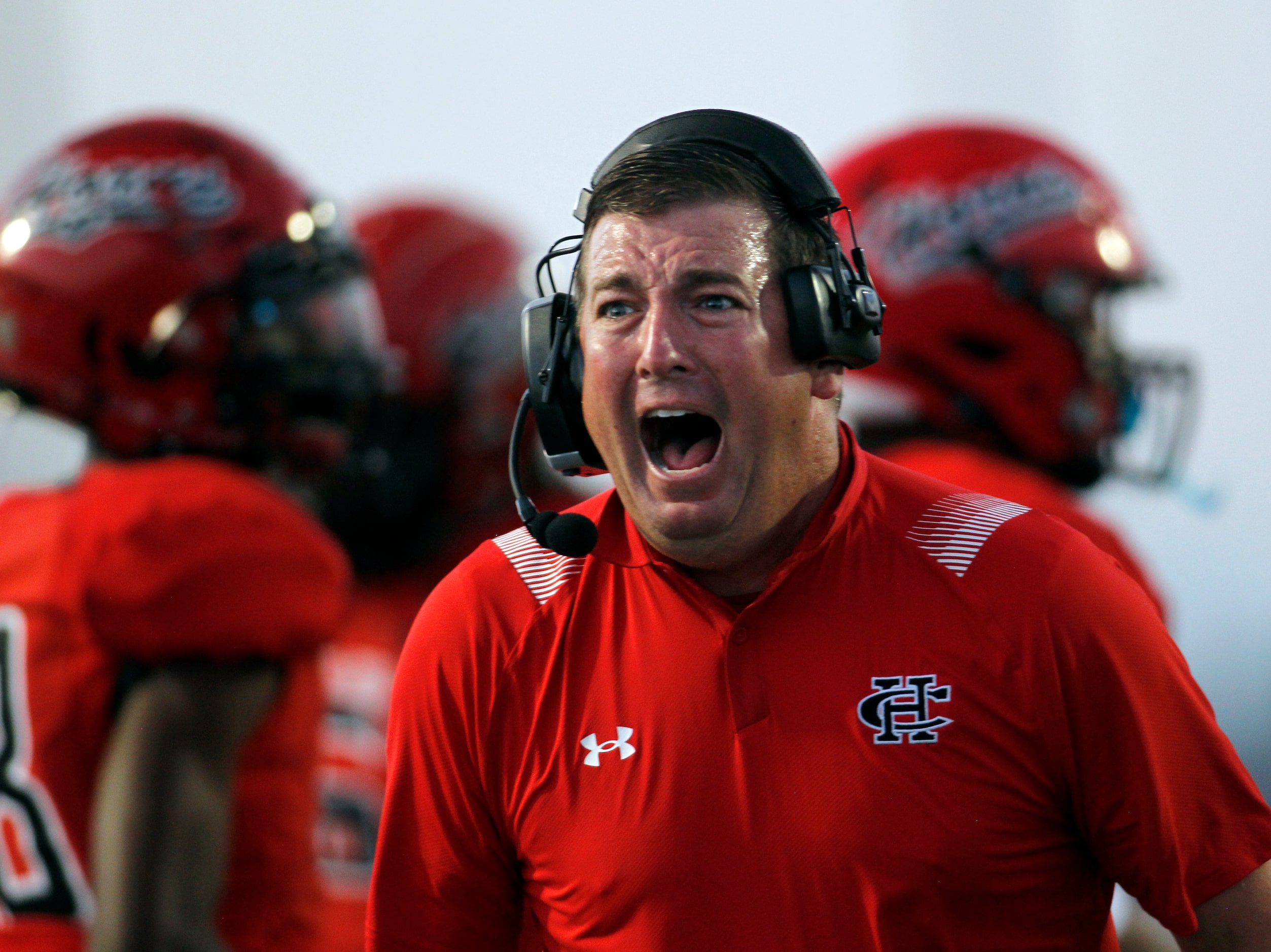 Cedar Hill offensive coordinator Kyle Morales reacts following a first half touchdown in...