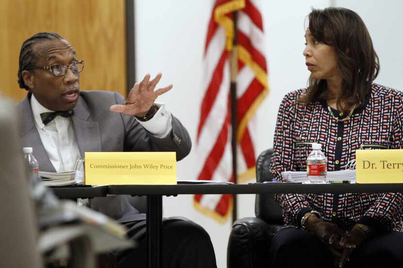 Dallas County Commissioner John Wiley Price speaks to a gentleman in attendance at a weekly...