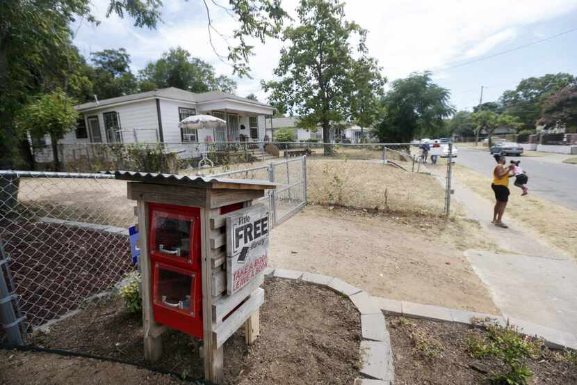 A Little Free Library located in front of a neighborhood garden in the Mill City...