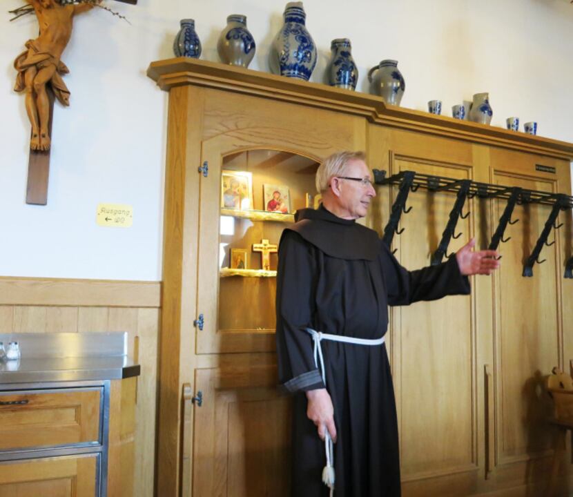 Father Klaus, the superior, gives cruise passengers the lowdown about the wine- and...
