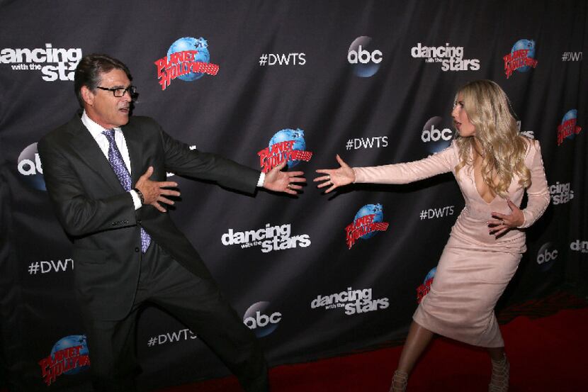 Rick Perry and Emma Slater arrive at Planet Hollywood in New York City.