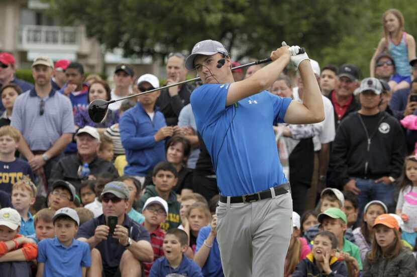 The gallery watches Pro Golfer Jordan Spieth demonstrate a shot at the Byron Nelson youth...