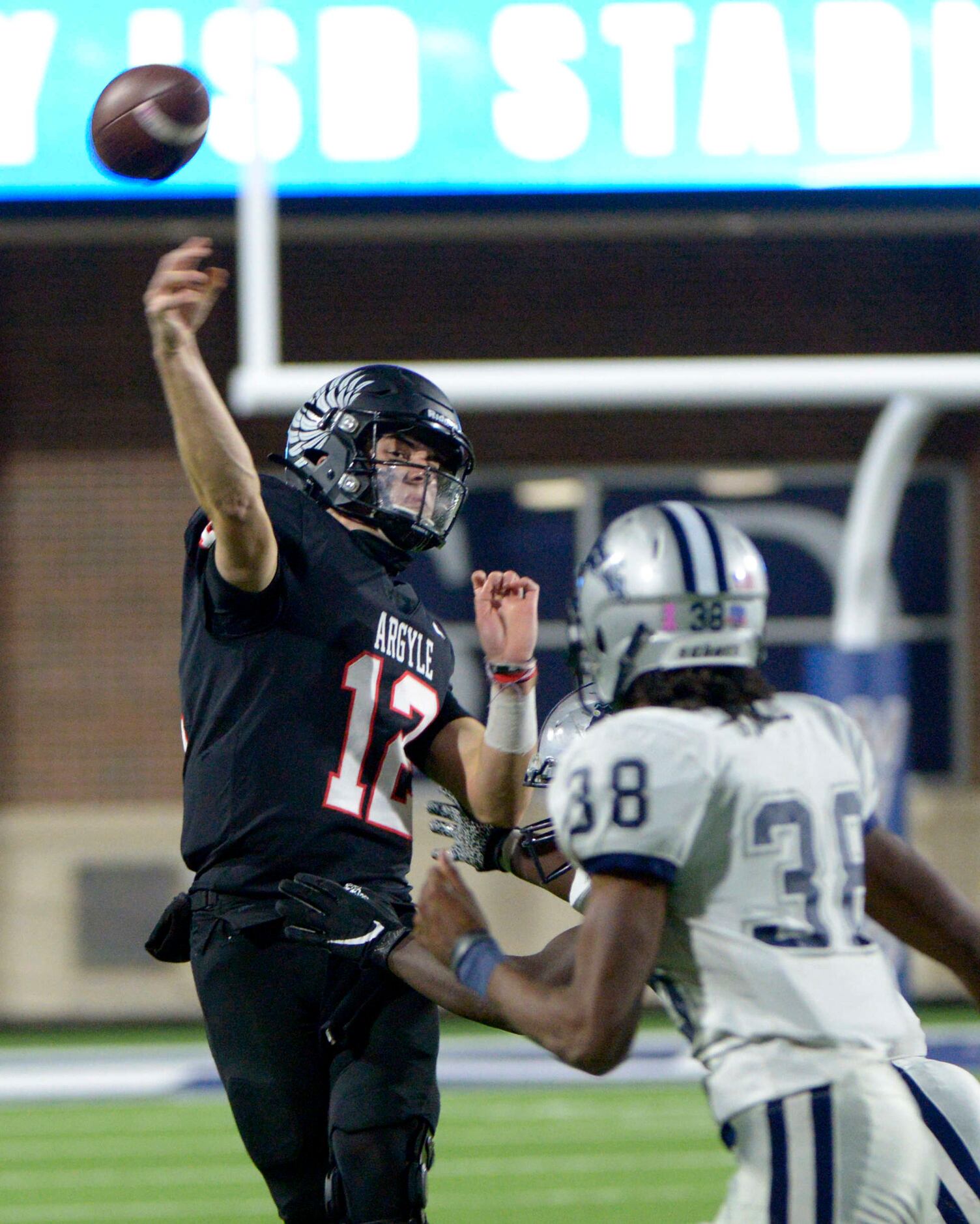 Argyle’s CJ Rogers passes under pressure in the second half during a Class 4A Division I...