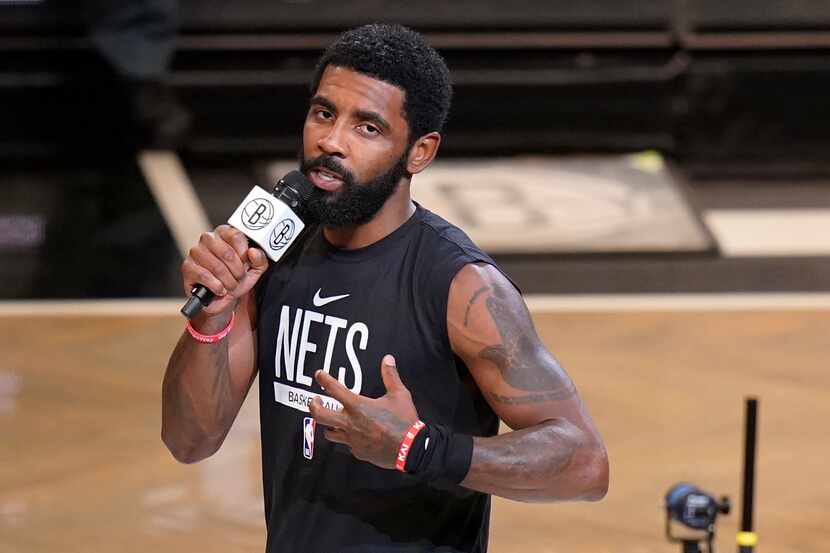 FILE - Brooklyn Nets' Kyrie Irving speaks before the team's NBA basketball game against the...