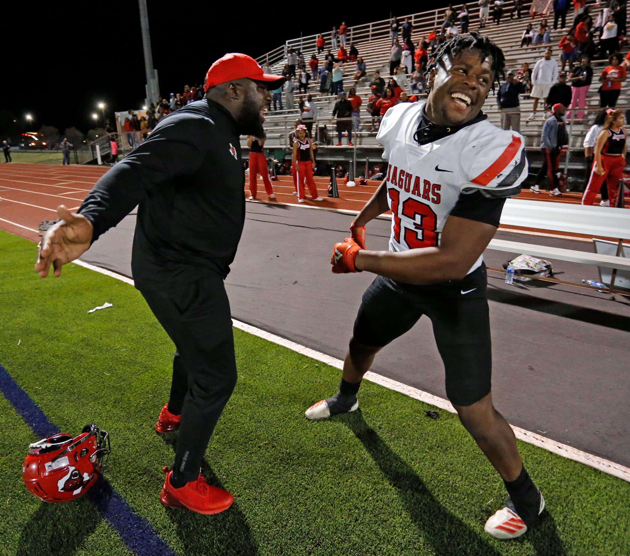 A coach and Mesquite horn and defender Armstrong Nnodim (13) celebrate his Nnodim’s “Pick...