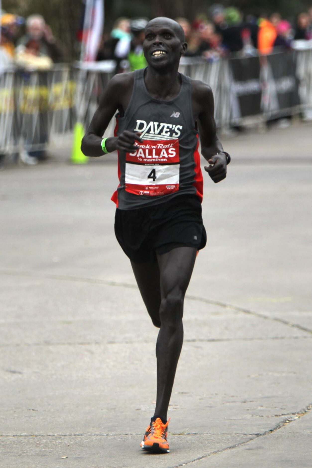 Men's first place winner Julius Kiptoo runs in the finish line with a time of 1:06:57 during...