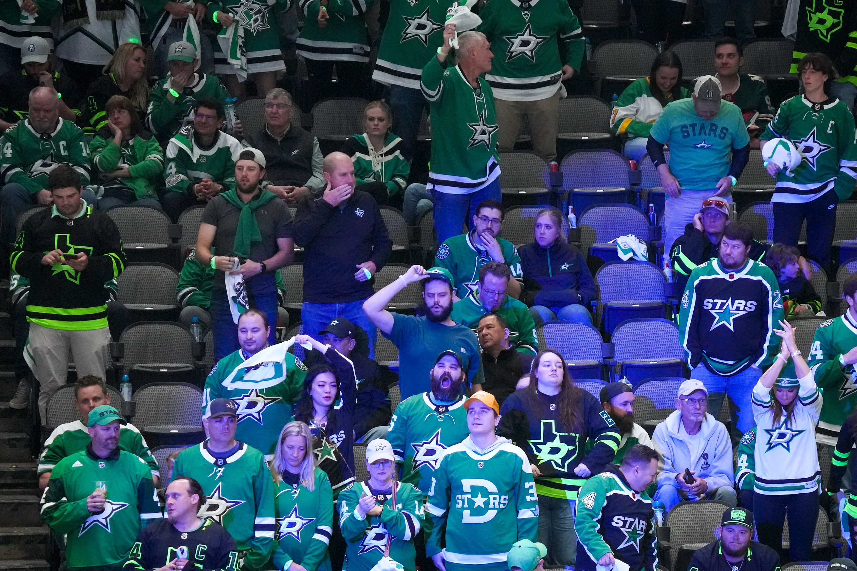 Fans cheer as the teams take the ice for the second overtime in Game 1 of a first-round NHL...