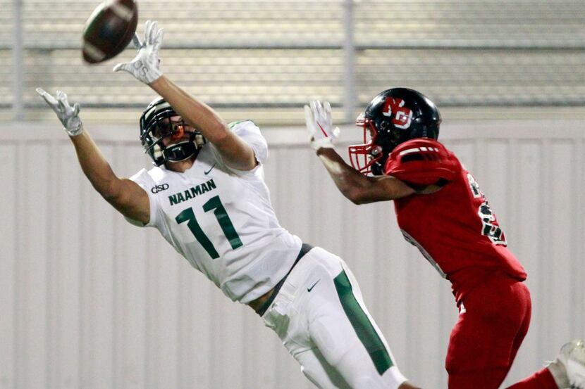 Garland Naaman Forest wide receiver Devean Deal (11) stretches out to catch a long pass...
