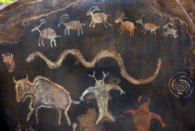 Replicas of cave paintings are drawn into stone at the Rory Meyers Children's Adventure...