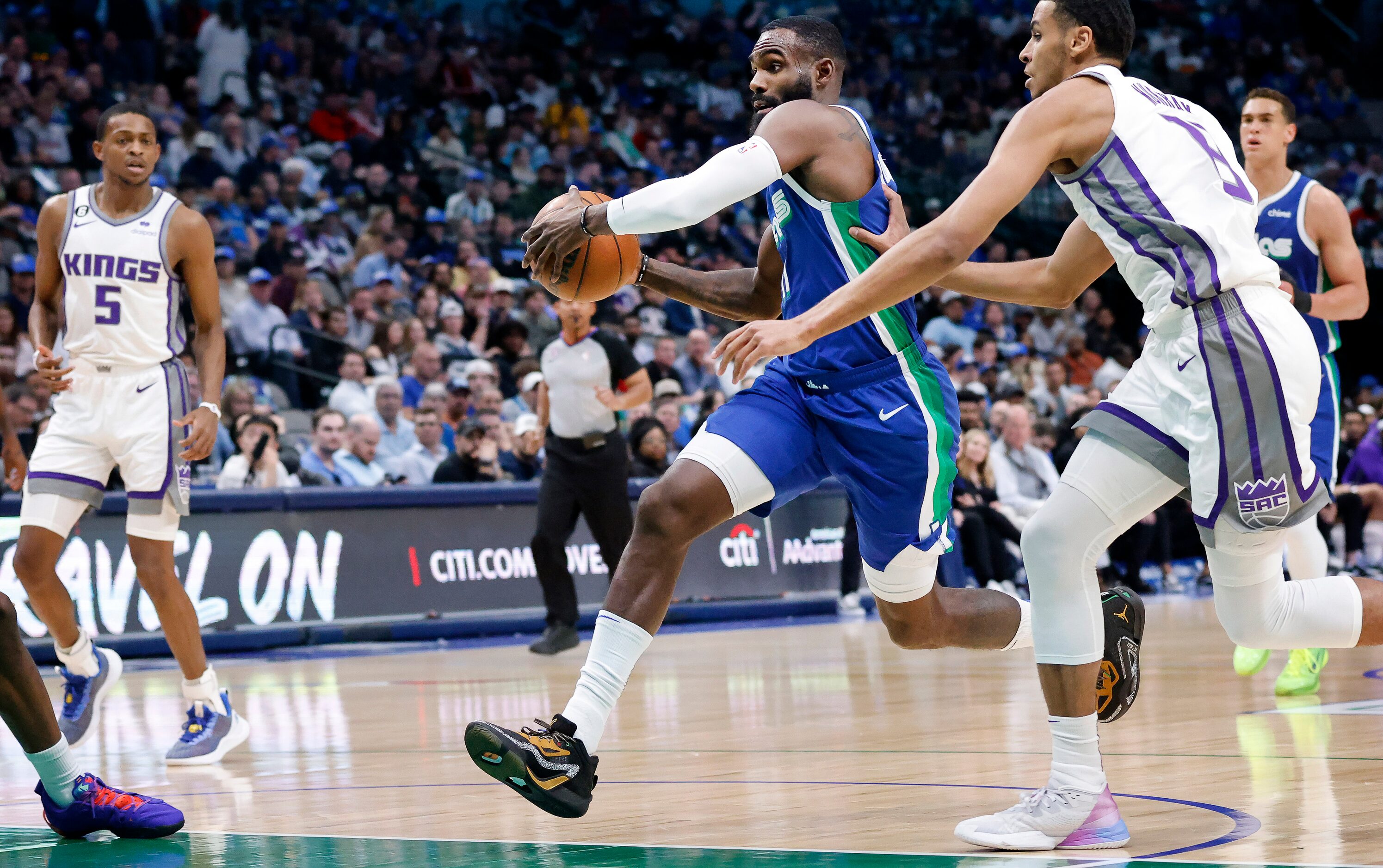 Dallas Mavericks forward Tim Hardaway Jr. (11) drives the lane for a first half lay-up...