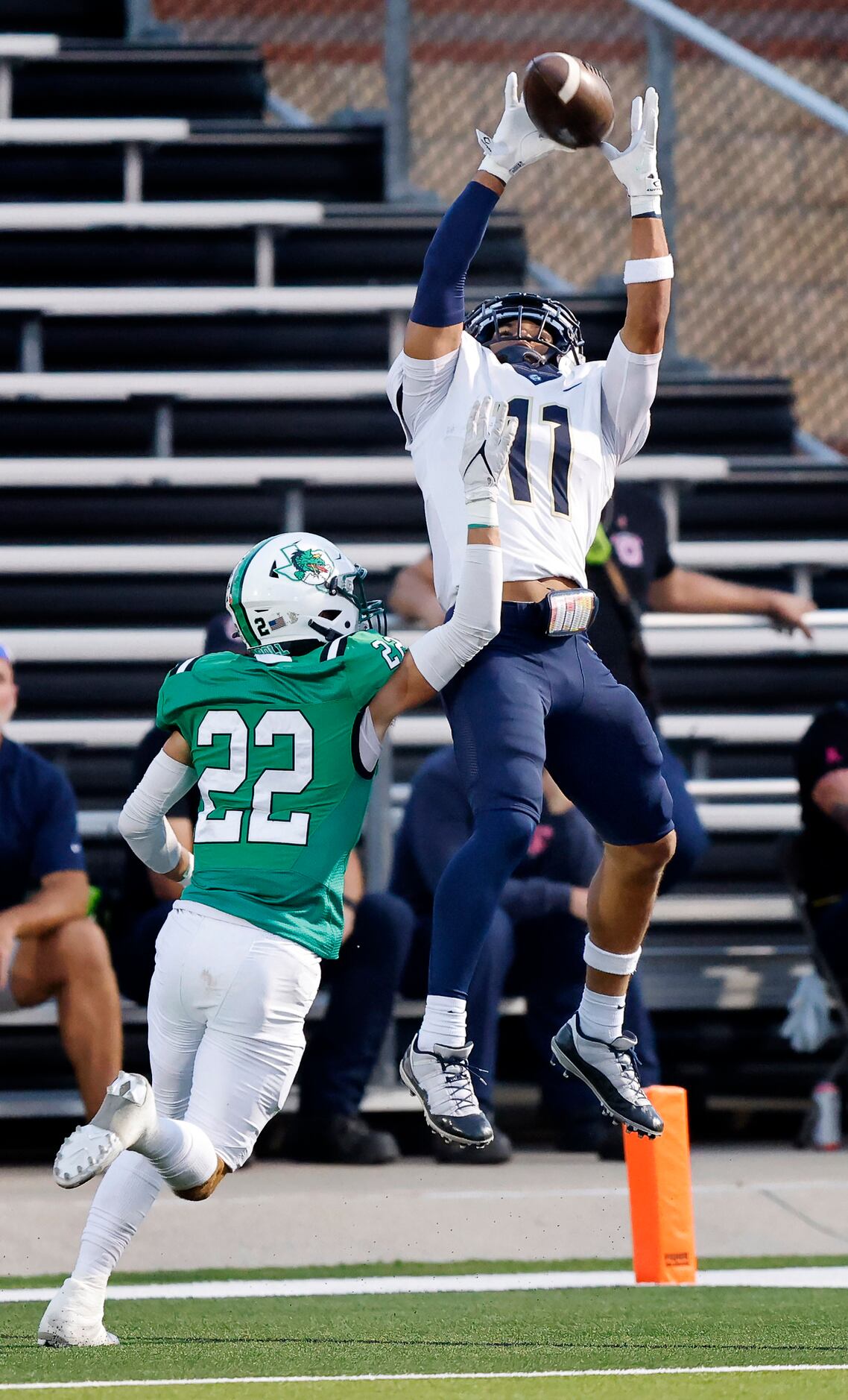 Keller wide receiver Amarion Henry (11) goes high in the air to catch a first quarter...