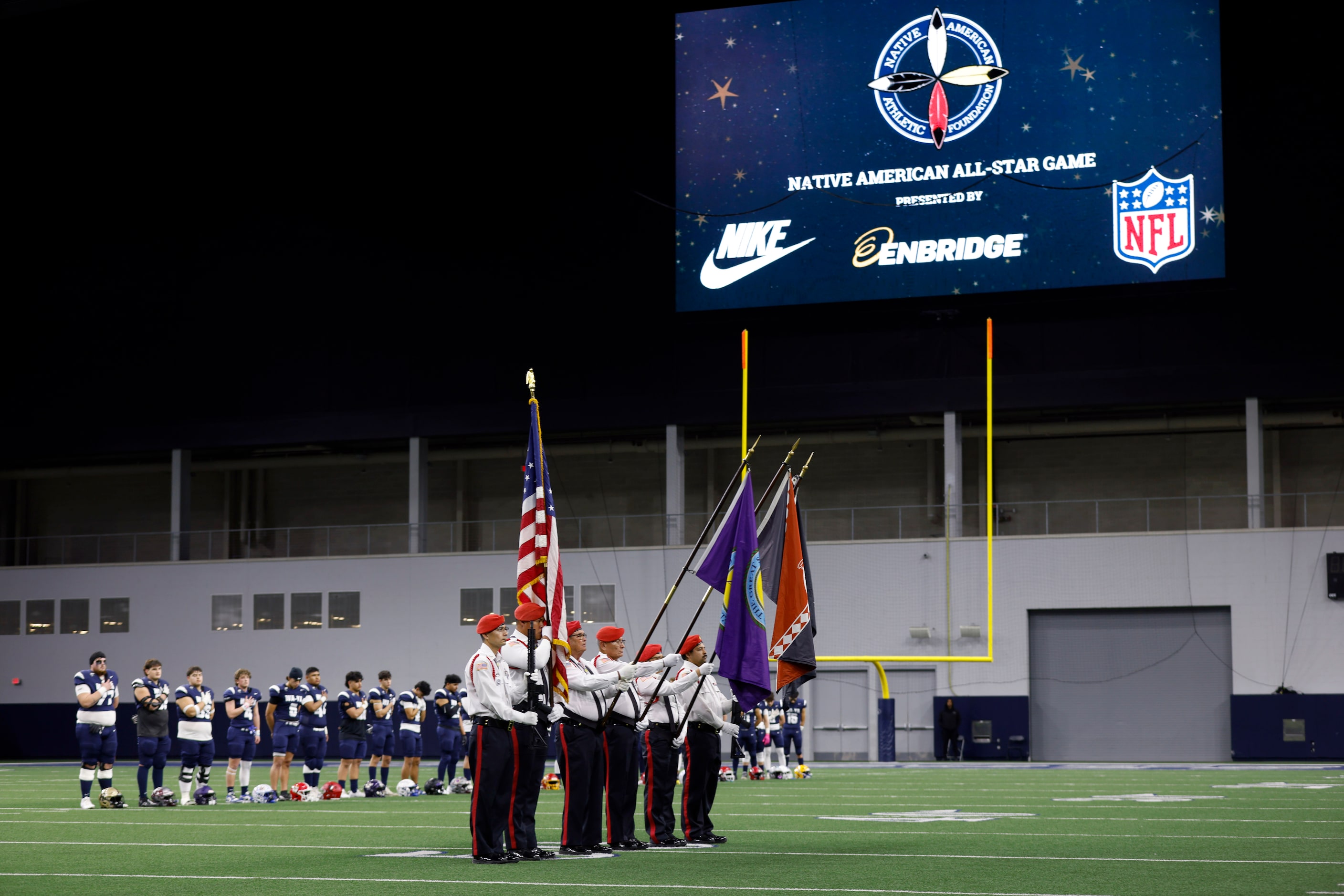 The Choctaw Nation Honor Guard from Durant, OK present the colors during the national anthem...